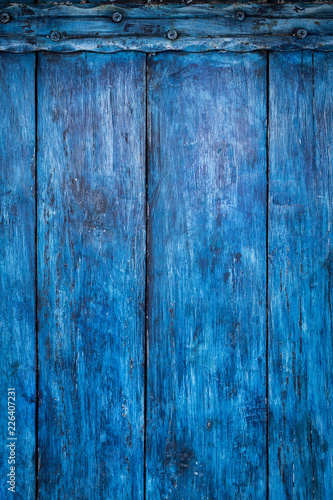 Bright blue painted old board, boho abstract background photo