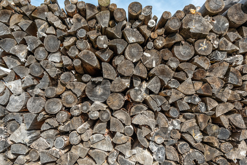 Chopped firewood in woodpile winter