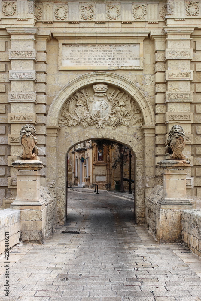 Ancient limestone gateway into city of Mdina, Malta