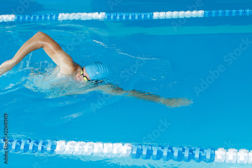 Freestyle swimmer in swimming pool