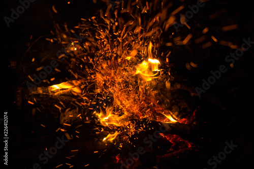 Beautiful bonfire with sparks flying upwards, view from above