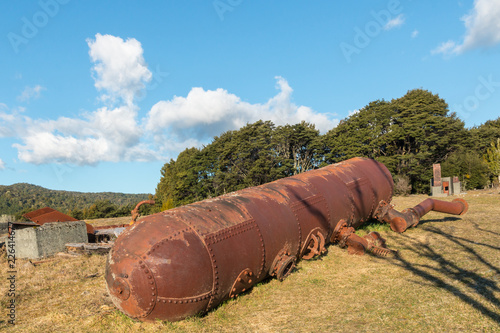 rusty cylinder at goldmine in Waiuta on the West Coast, South Island, New Zealand