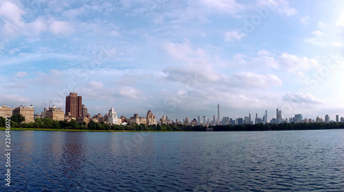 Jacqueline Kennedy Onassis Reservoir beautiful clear sunny day with blue sky and clouds and Manhattan skyline