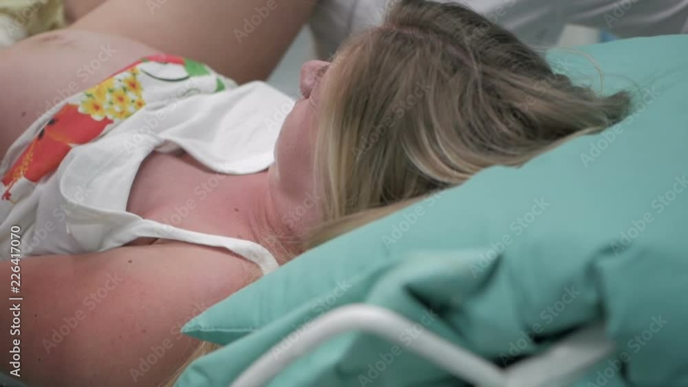 A woman gives birth in a hospital. Real delivery video Stock Video | Adobe  Stock