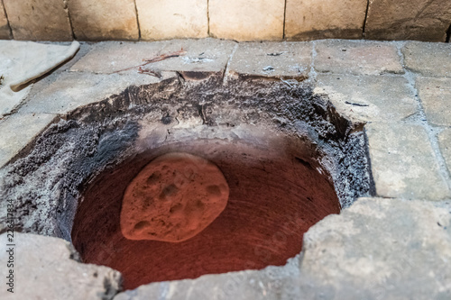 Taftoon Bread Baking in Tandoori Oven photo