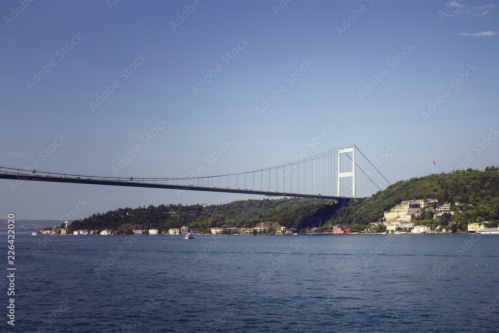 Fototapeta premium View of FSM bridge on Bosphorus and Asian side in Istanbul. It is a sunny summer day.