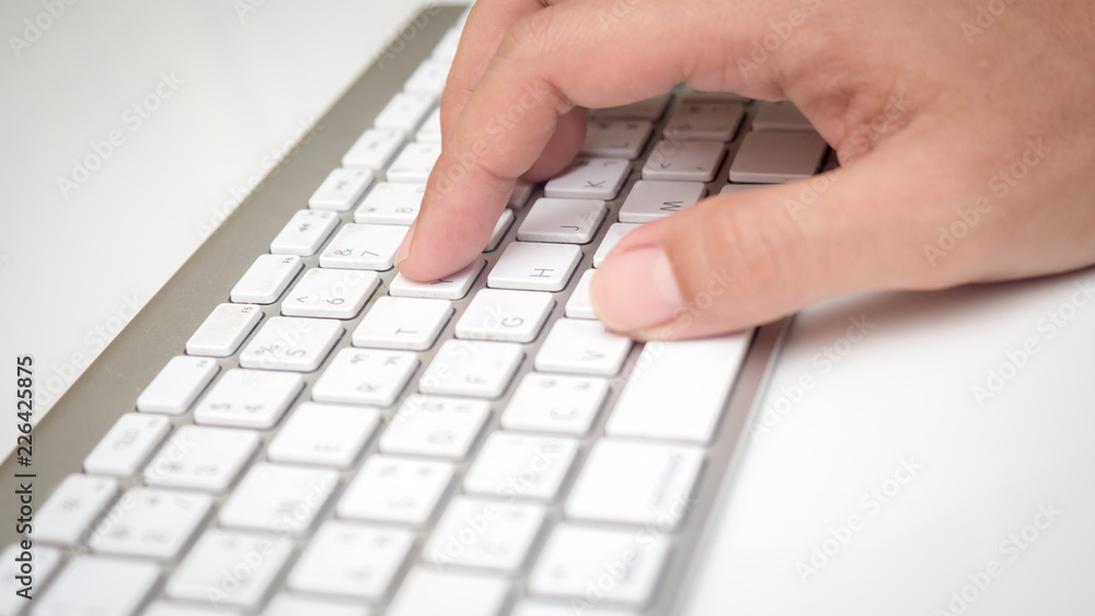 Man's hands typing on keyboard Man's hands typing on keyboard