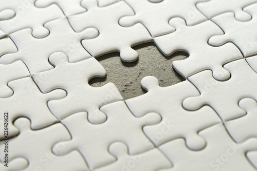 Fototapeta Incomplete, unfinished business strategy or finalize, problem solution metaphor, jigsaw puzzle with uncompleted missing piece