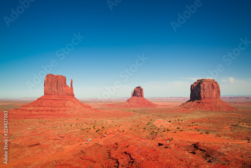 sunset in the desert with scenic rocks and monument