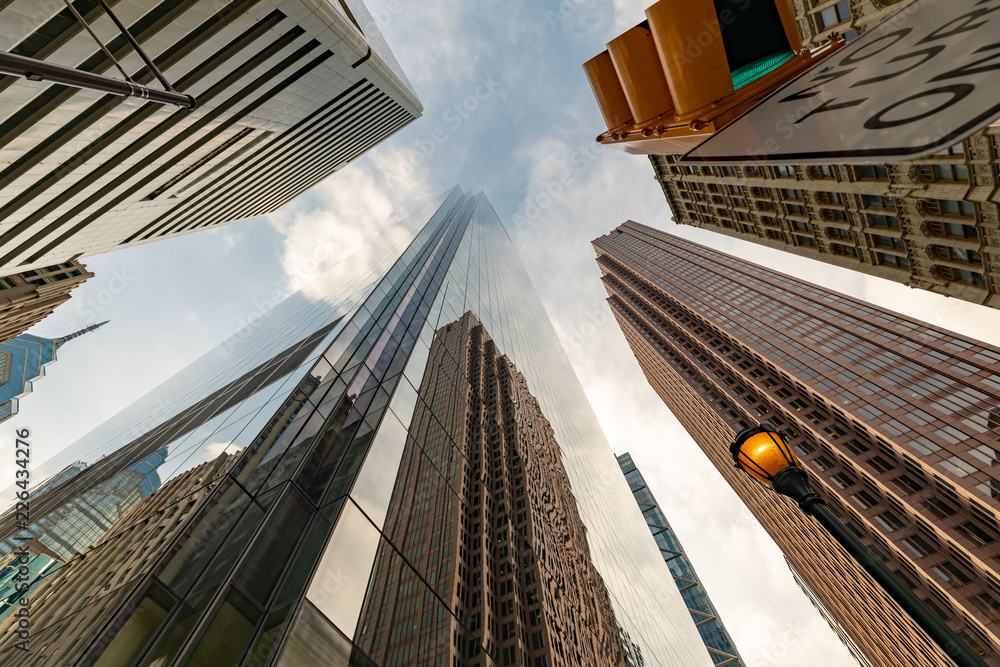 Looking up to the sky from the city sidewalk
