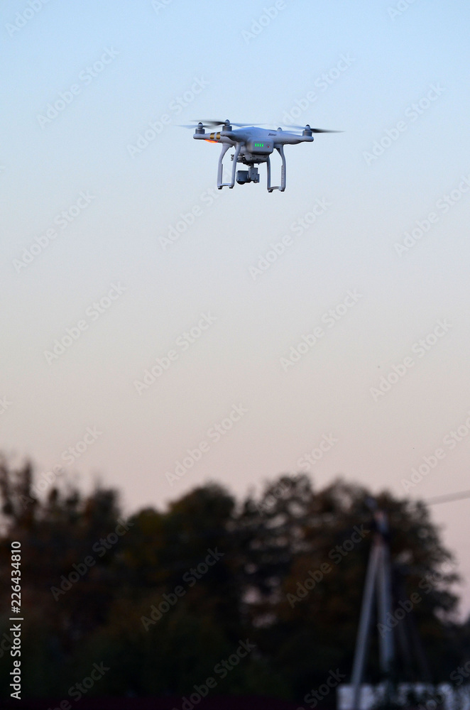 A beautiful flying drone in the evening skies. Aero photography in action.
A beautiful flying drone in the evening skies. Aero photography in action.
