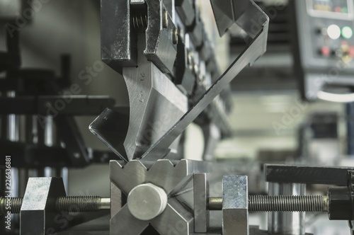 bending metal on a sheet bending machine, at the factory