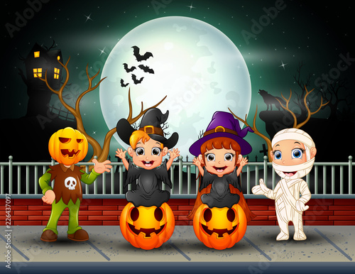 Happy halloween kids in full moon background