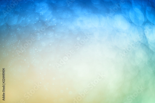Blurred abstract bokeh light of fly water background, Christmas two tone colors.