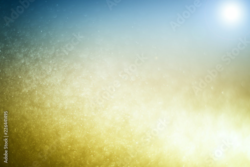 Blurred abstract bokeh light of fly water background, Christmas two tone colors.