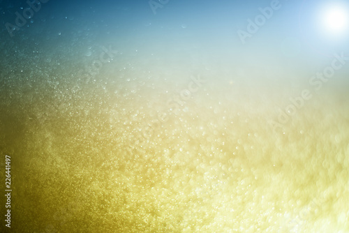 Blurred abstract bokeh light of fly water background, Christmas two tone colors.