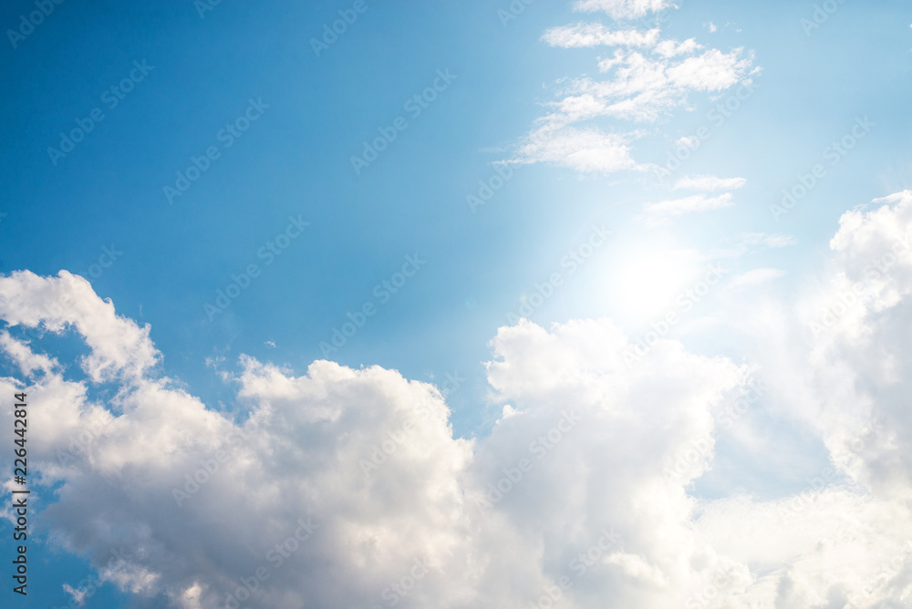Blue sky with soft clouds and beautiful day of sun.