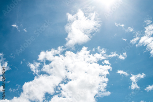 Summer sky and beautiful sun in the blue sky with clouds.