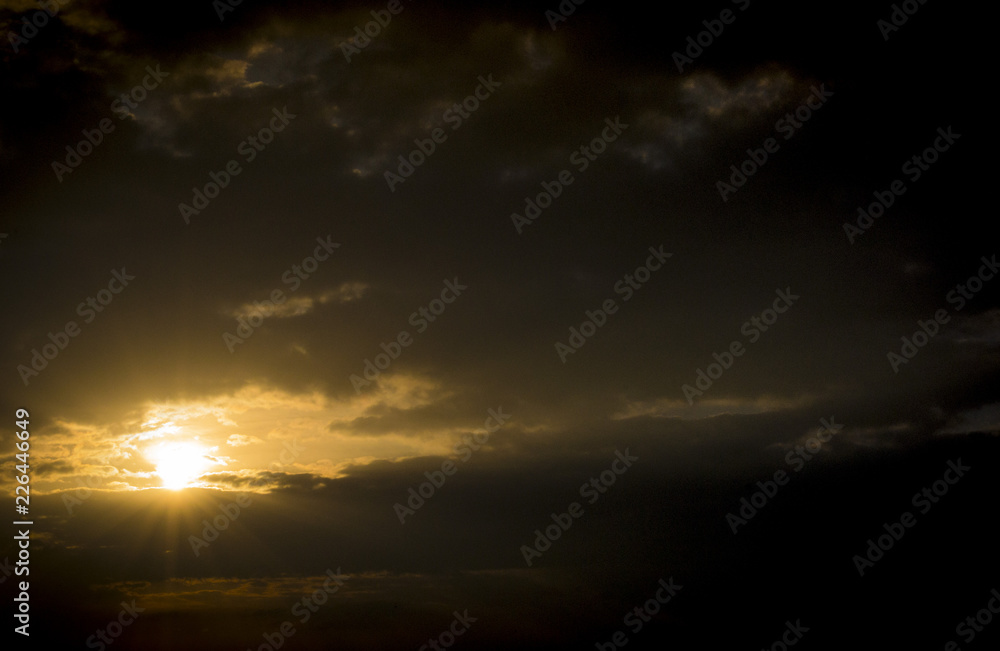 Dramatic epic cloud sky and sun at sunrise or sunset Dramatic epic cloud sky and sun at sunrise or sunset