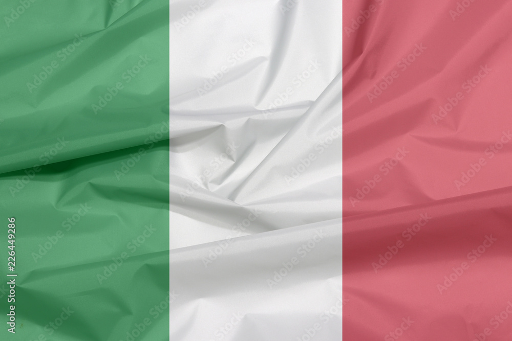 Obraz premium Fabric flag of Italy. Crease of Italian flag background, green white and red color.