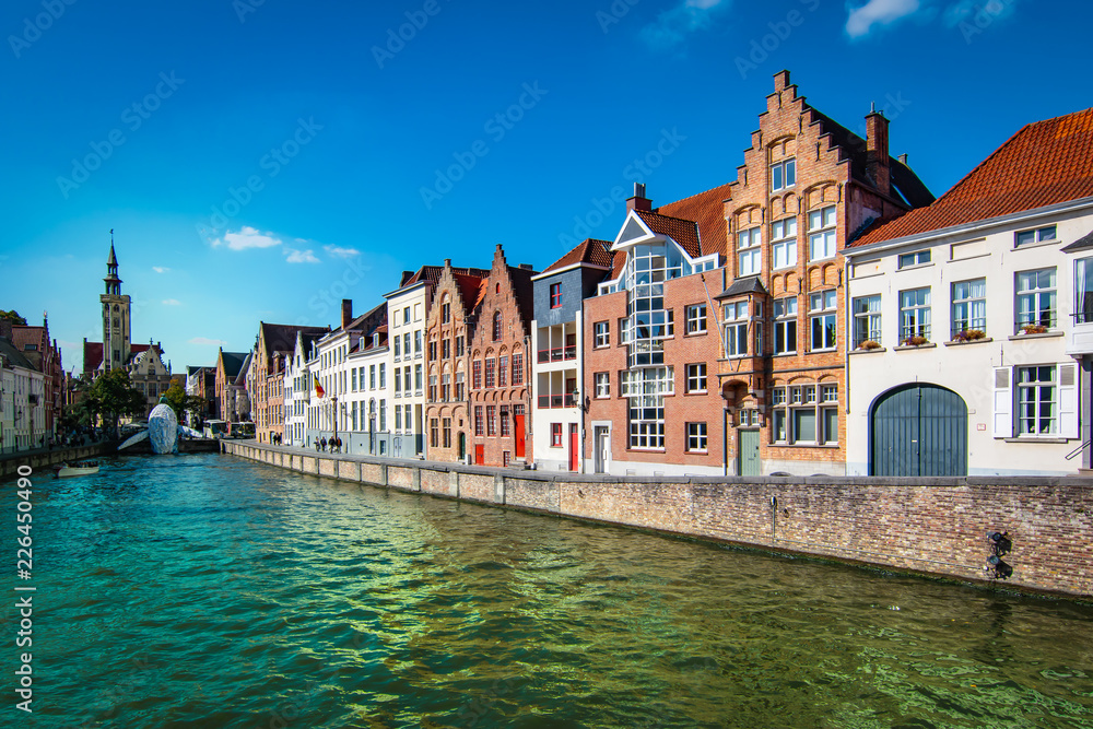 Scenic city view of Bruges canal with beautiful medieval houses. Scenic city view of Bruges canal with beautiful medieval houses.