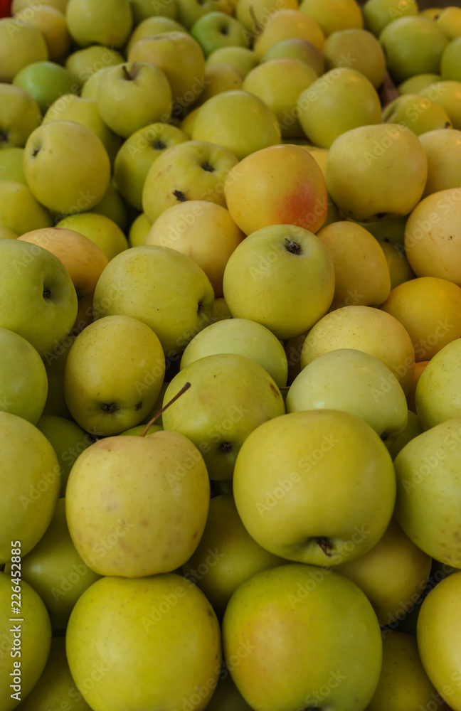 Fresh, tasty, juicy, yellow apples in a box Fresh, tasty, juicy, yellow apples in a box