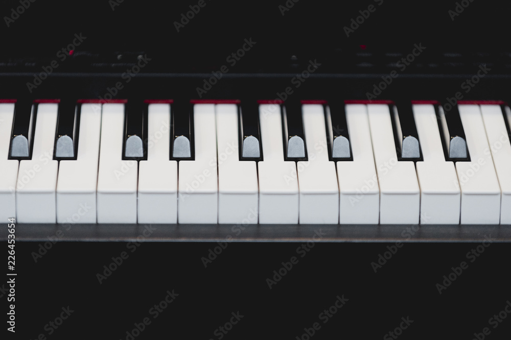 Fototapeta premium Close up detail of the piano keyboard. World of music