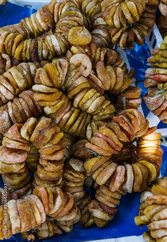 Dried brown figs on the rope on Montenegro's farm market. Dried brown figs on the rope on Montenegro's farm market.