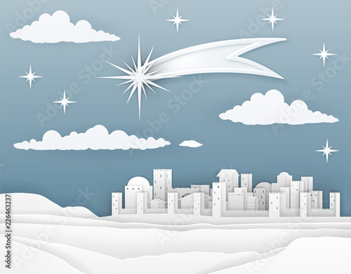 A nativity Christmas scene in a cut paper style. City of Bethlehem in background with guiding star above announcing the birth of baby Jesus. Christian religious illustration.