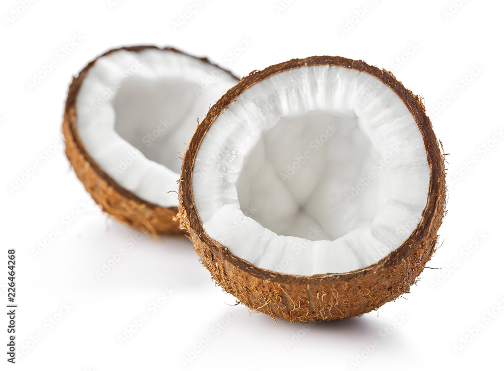 two halves of ripe coconut isolated on white background two halves of ripe coconut isolated on white background
