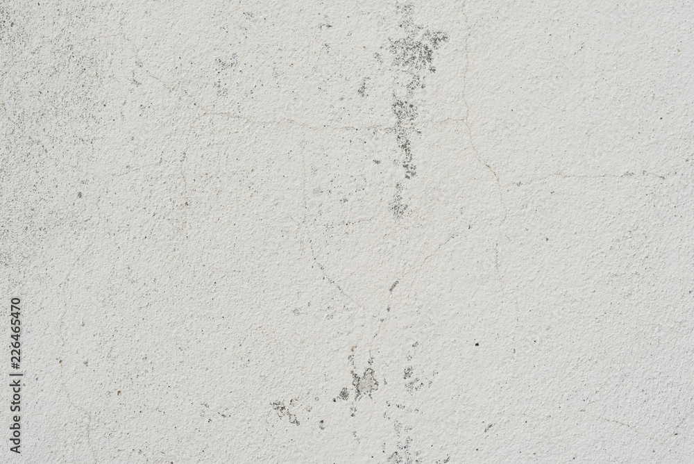 Wall fragment with scratches and cracks. It can be used as a background Wall fragment with scratches and cracks. It can be used as a background