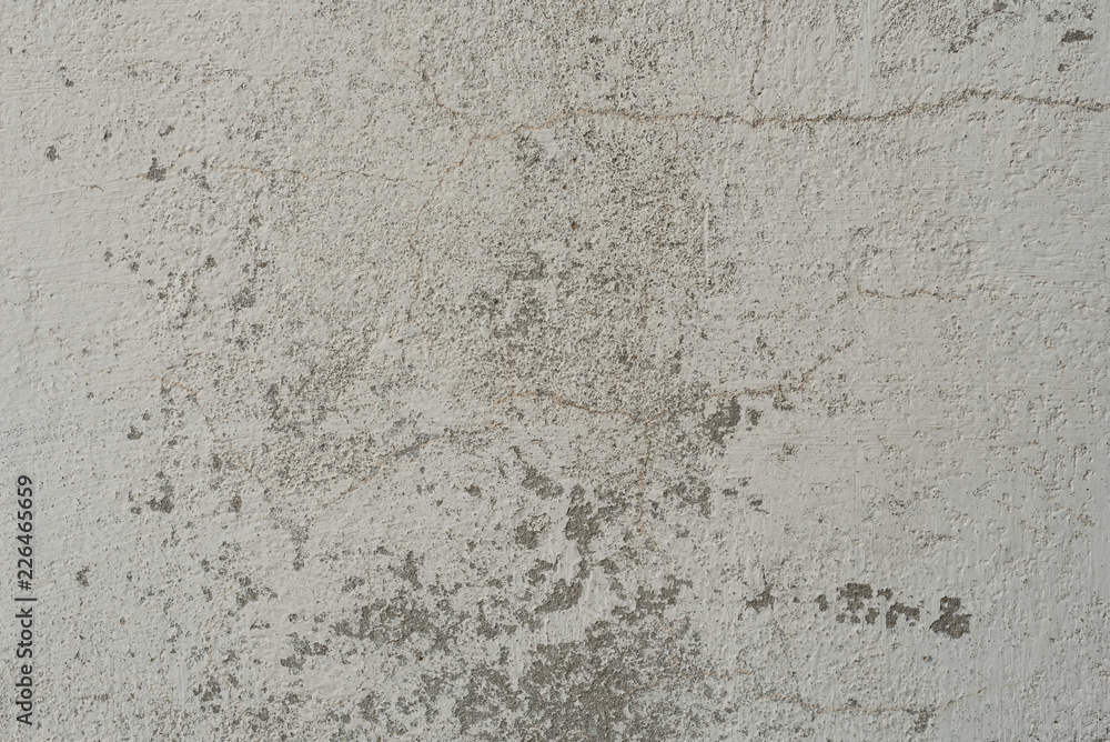 Wall fragment with scratches and cracks. It can be used as a background Wall fragment with scratches and cracks. It can be used as a background