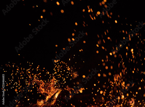 Burning sparks flying. Beautiful flames background.