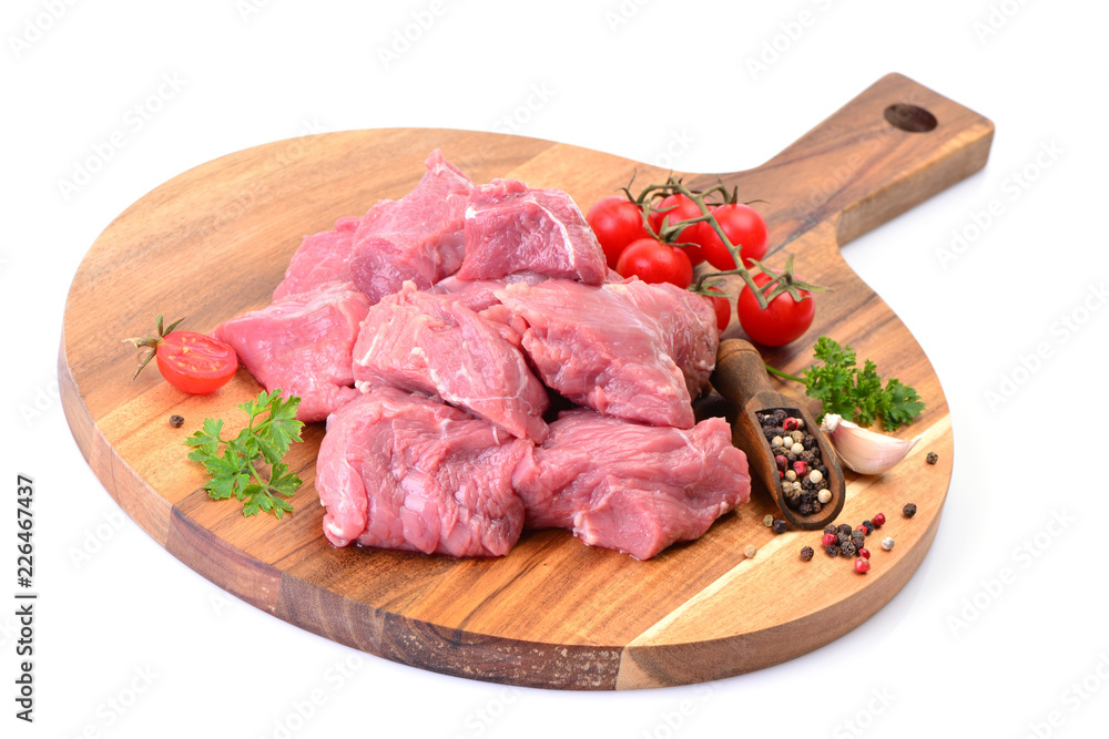 Beef meat with spices and vegetables on a white background