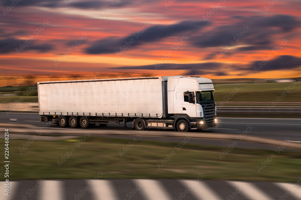 Truck with container on road, cargo transportation concept.