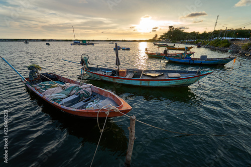 View of the fishing harbor Sunset Latinos There is a boat landing. In a fishing village in Rayong, Thailand, fishing is the main occupation of the people. © zasabe