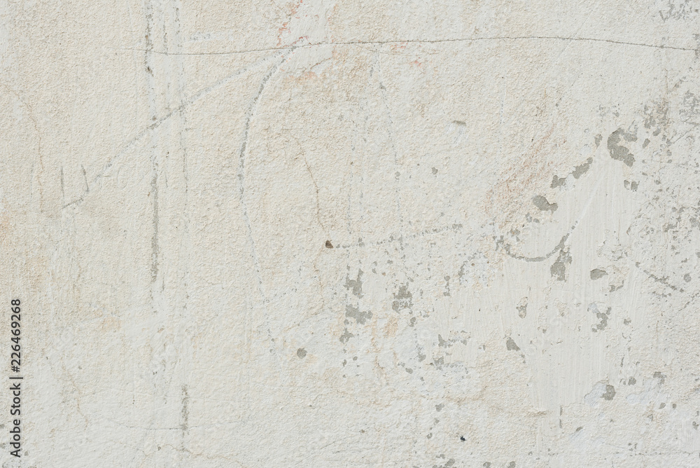 Fototapeta premium Wall fragment with scratches and cracks. It can be used as a background