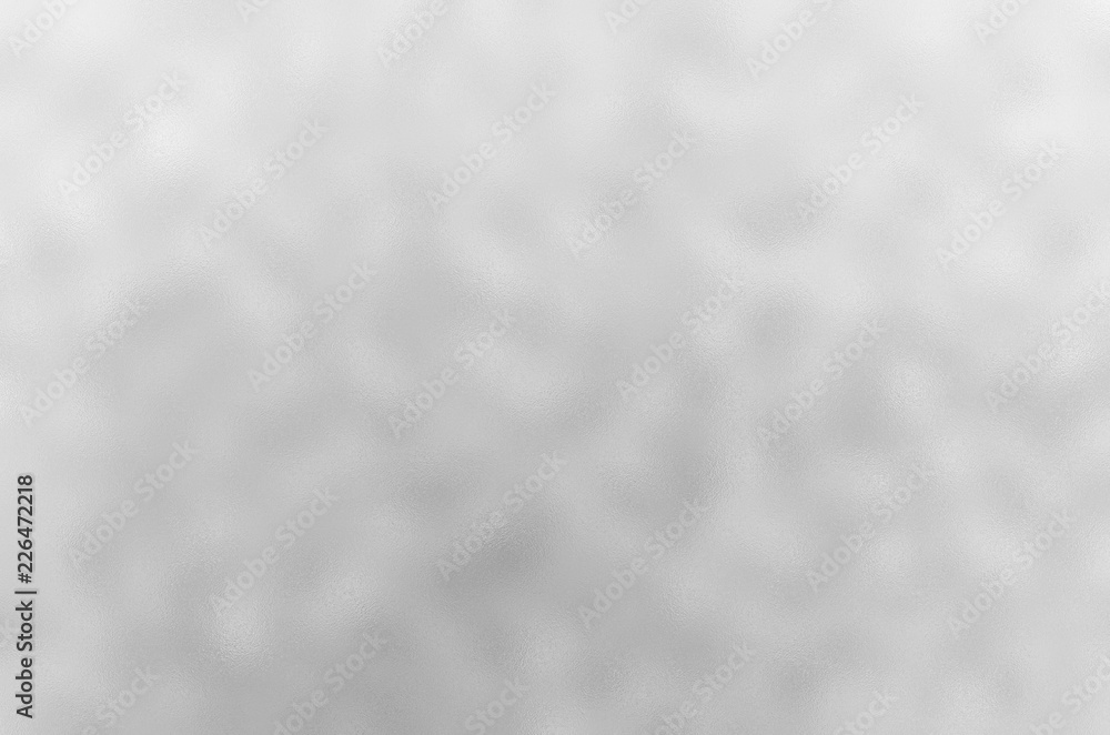 Silver glitter texture. Shiny silver foil texture. Grey metallic decorative background. Christmas or new year background for design. Silver glitter texture. Shiny silver foil texture. Grey metallic decorative background. Christmas or new year background for design.