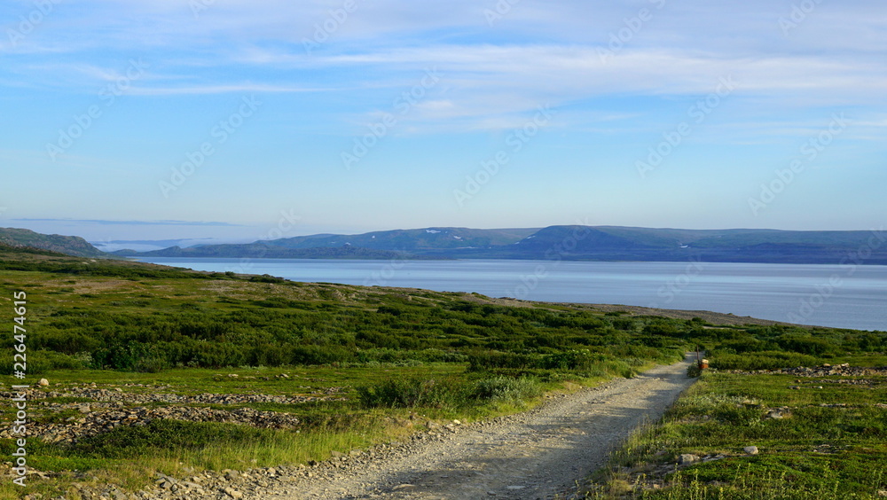 landscape with road to the coastline and clouds landscape with road to the coastline and clouds