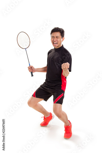 Excited badminton player winning a game