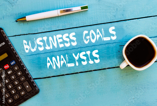 Business Goals Analysis on blue table concept photo