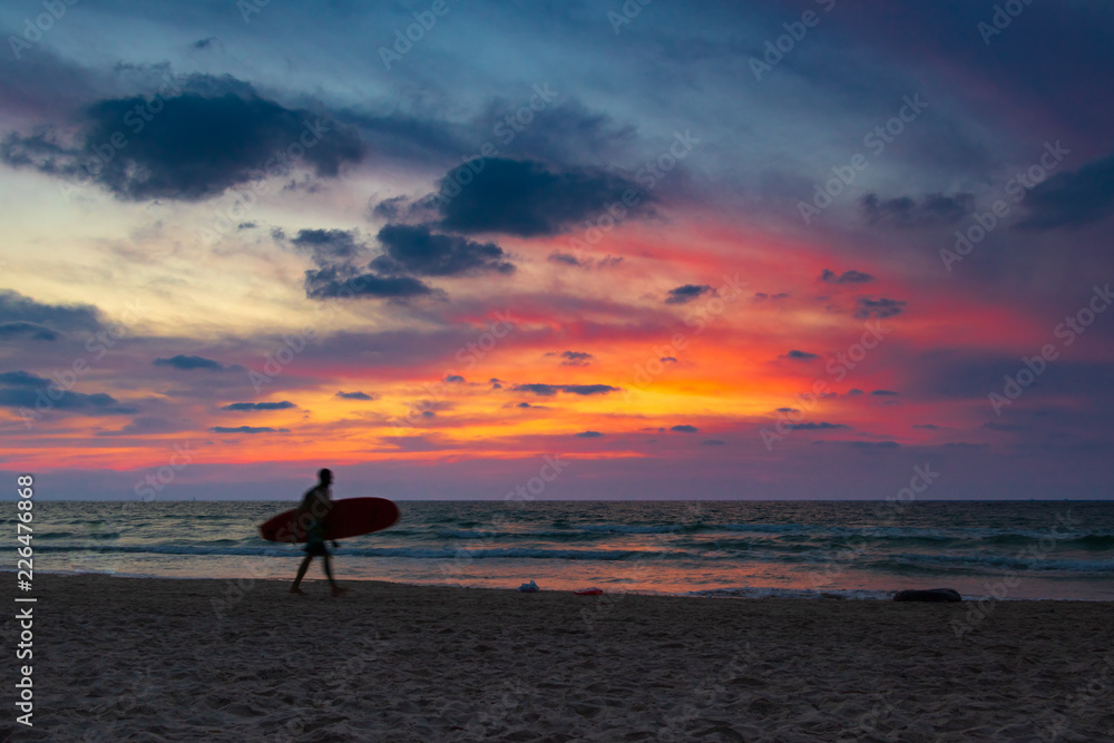 Surfer in sunset light (horizontal)