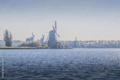 Water landscape with windmills at Zaanse Schans near Amsterdam, Netherlands