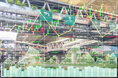 Stock financial index of successful investment on transportation business with chart and graph on superhighway intersection background at Bangkok Thailand.