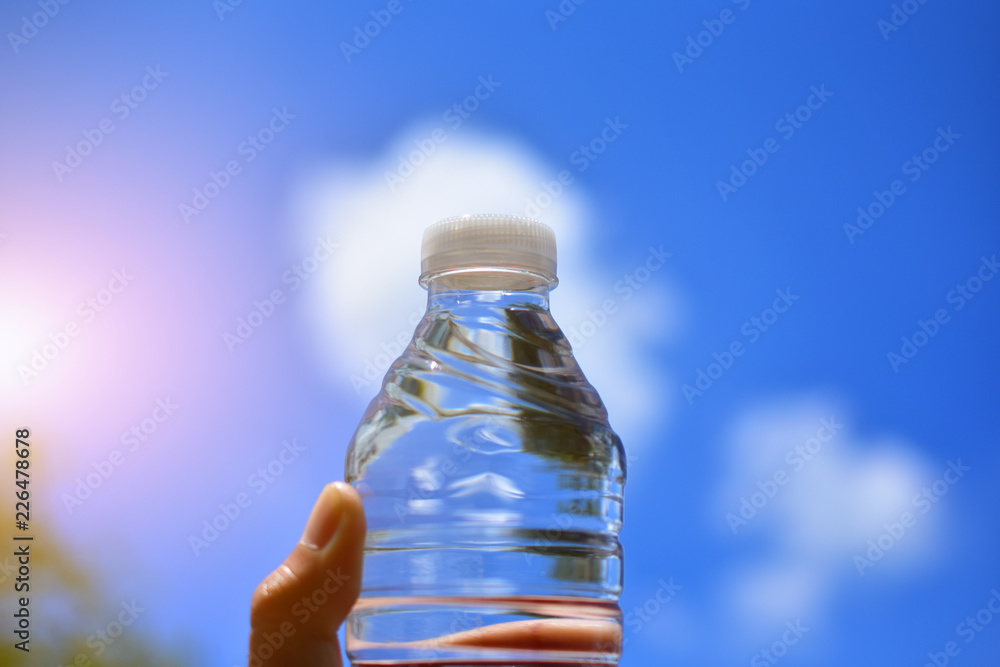 Hand holding drinking water for drink after exercise body sport Hand holding drinking water for drink after exercise body sport