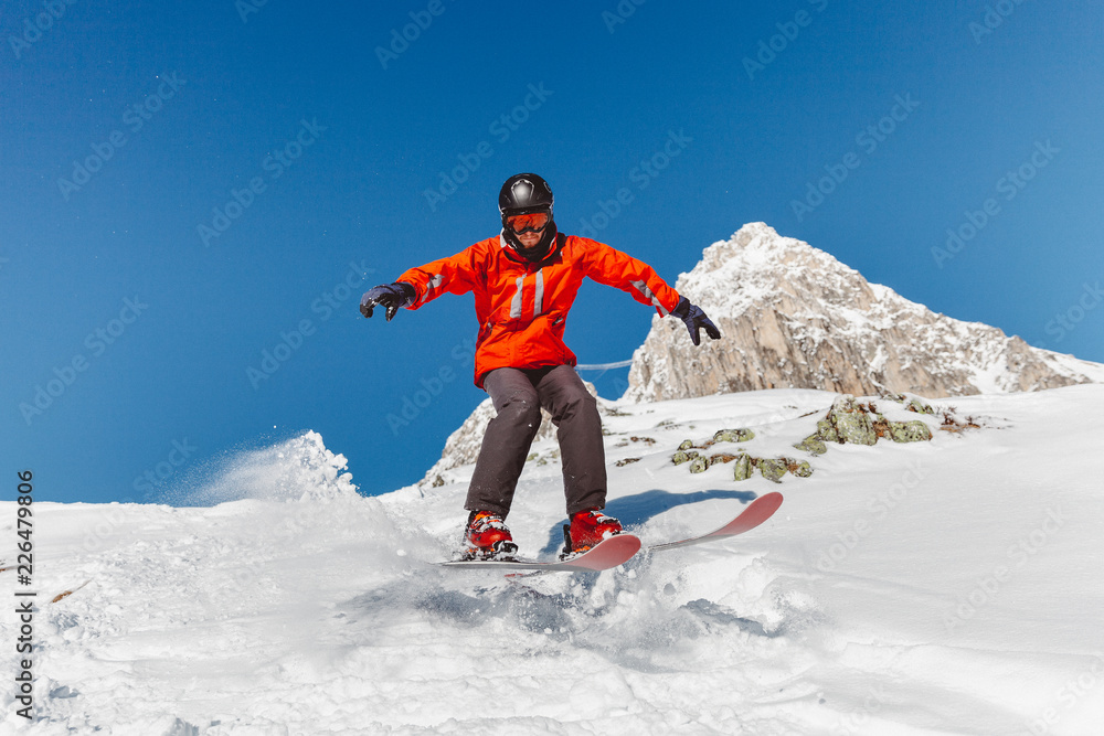 Skier in a red jacket in the French Alps