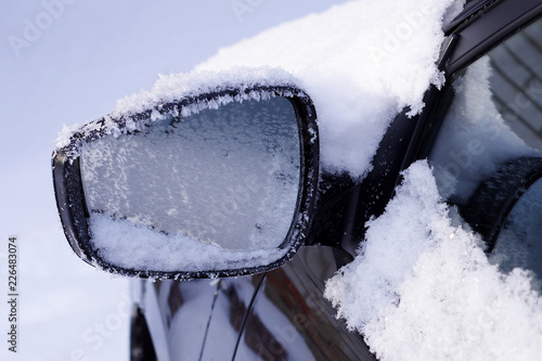 The frozen car side mirror close-up