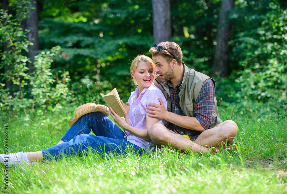 Couple in love spend leisure reading book. Couple soulmates at romantic date. Pleasant weekend. Romantic couple students enjoy leisure with poetry nature background. Romantic date at green meadow
