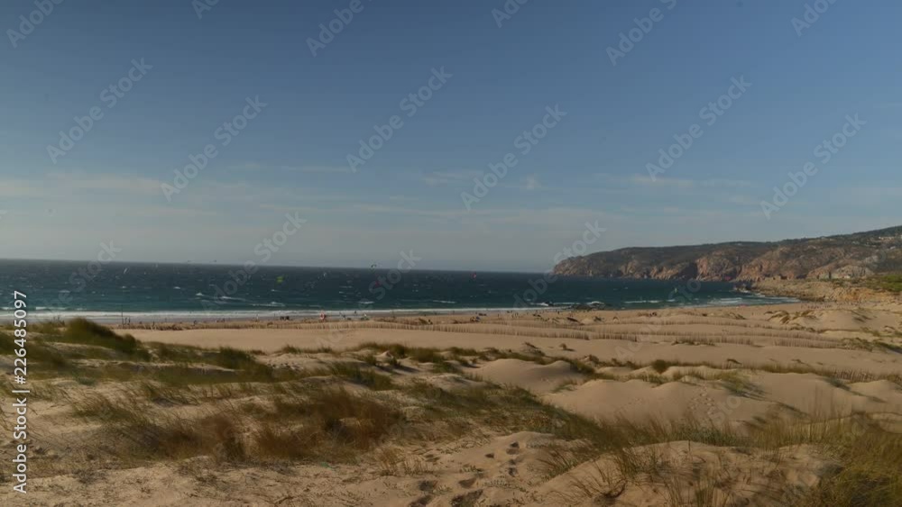 Timelapse of Kitesurfers at Guincho Beach, Portugal on a summer day Timelapse of Kitesurfers at Guincho Beach, Portugal on a summer day