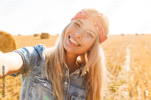 Beautiful smiling young blonde girl in headband